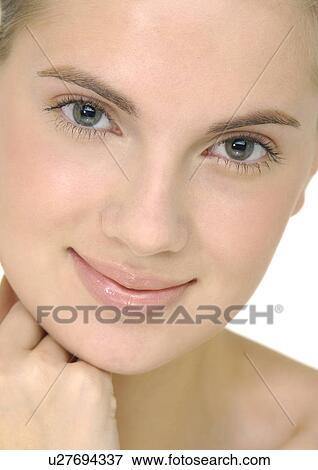 Portrait of a young woman smiling View Large Photo Image Stock Photo - Portrait of a young woman smiling. Fotosearch