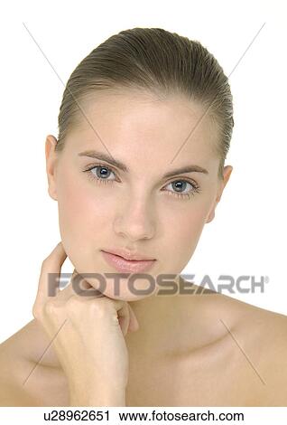 Portrait of a young woman with her hand on her chin View Large Photo Image Stock Image - Portrait of a young woman with her hand on her chin. Fotosearch