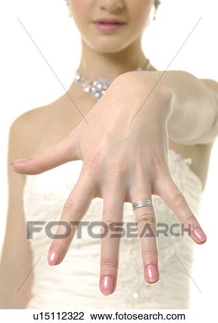 Close-up of a bride showing her wedding ring View Large Photo Image Stock Image - Close-up of a bride showing her wedding ring. Fotosearch