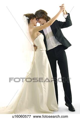Newlywed couple dancing and smiling View Large Photo Image Stock Photo - Newlywed couple dancing and smiling. Fotosearch