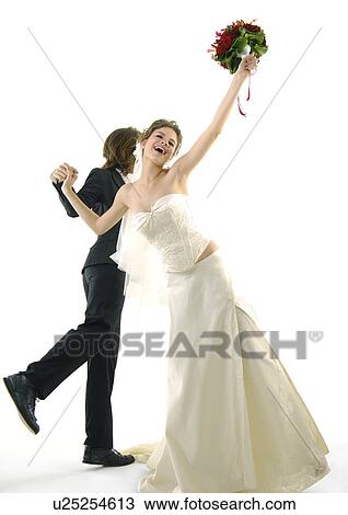 Stock Image - Newlywed couple dancing. Fotosearch
