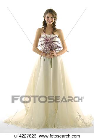 Portrait of a bride holding a bouquet of flowers and smiling View Large Photo Image Stock Image - Portrait of a bride holding a bouquet of flowers and smiling. Fotosearch