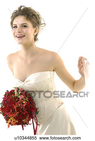 Portrait of a bride holding a bouquet of flowers and smiling View Large Photo Image Stock Photography - Portrait of a bride holding a bouquet of flowers and smiling. Fotosearch