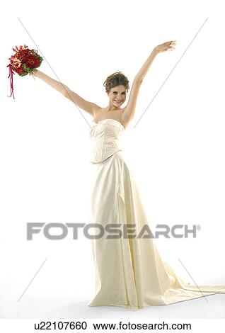 Portrait of a bride raising her arms and smiling View Large Photo Image Stock Image - Portrait of a bride raising her arms and smiling. Fotosearch