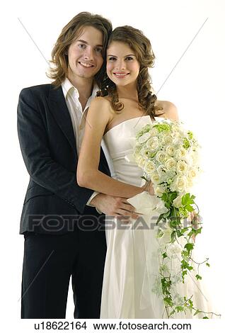Portrait of a newlywed couple smiling View Large Photo Image Picture - Portrait of a newlywed couple smiling. Fotosearch