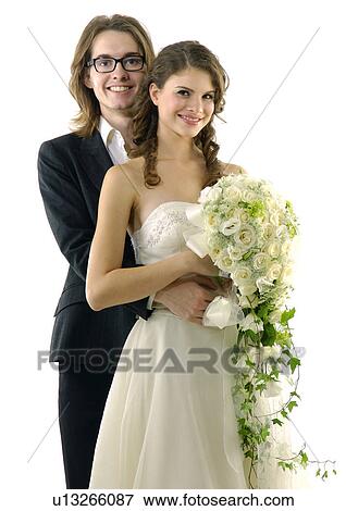 Portrait of a newlywed couple smiling View Large Photo Image Stock Photo - Portrait of a newlywed couple smiling. Fotosearch
