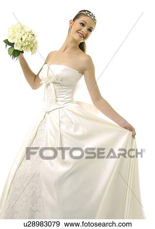 Bride holding a bouquet of flowers View Large Photo Image Stock Photo - Bride holding a bouquet of flowers. Fotosearch