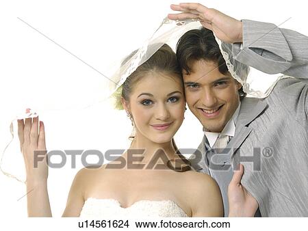 Portrait of a newlywed couple smiling View Large Photo Image Picture - Portrait of a newlywed couple smiling. Fotosearch