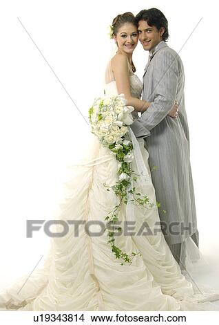 Picture - Portrait of a newlywed couple smiling. Fotosearch