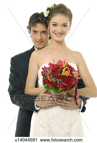 Stock Image - Portrait of a newlywed couple smiling. Fotosearch