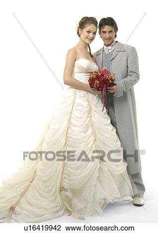Stock Image - Portrait of a newlywed couple smiling. Fotosearch