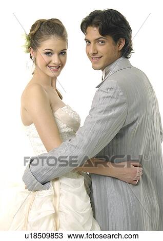 Stock Image - Portrait of a newlywed couple smiling. Fotosearch