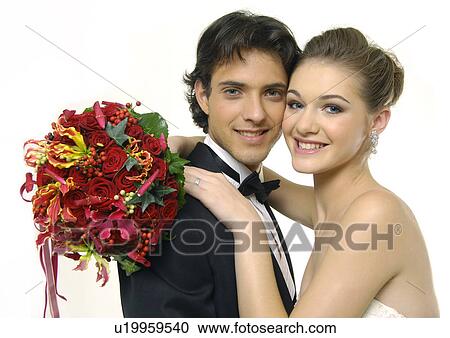 Portrait of a newlywed couple smiling View Large Photo Image Stock Image - Portrait of a newlywed couple smiling. Fotosearch