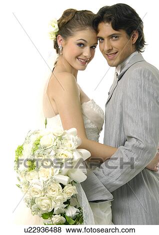 Portrait of a newlywed couple smiling View Large Photo Image Stock Photo - Portrait of a newlywed couple smiling. Fotosearch