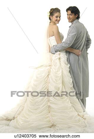 Stock Photography - Portrait of a newlywed couple smiling. Fotosearch
