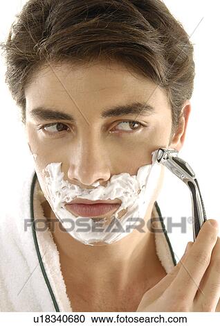 Close-up of a young man shaving View Large Photo Image Stock Image - Close-up of a young man shaving. Fotosearch