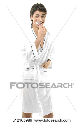 Portrait of a young man brushing his teeth View Large Photo Image Stock Photo - Portrait of a young man brushing his teeth. Fotosearch