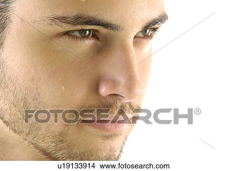 Picture - Close-up of a young man looking away. Fotosearch