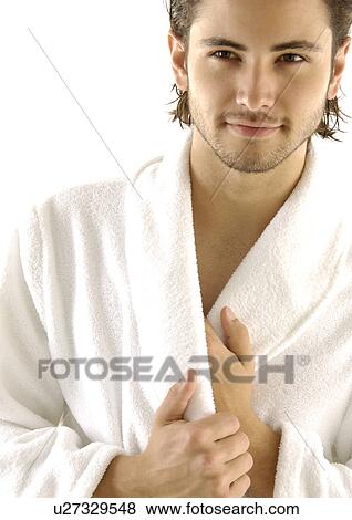 Stock Photo - Close-up of a young man looking away. Fotosearch