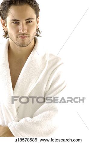 Close-up of a young man looking away View Large Photo Image Stock Photograph - Close-up of a young man looking away. Fotosearch