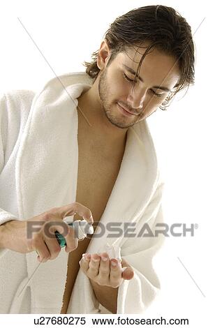 Close-up of a young man squeezing shaving cream on his hand View Large Photo Image Stock Photography - Close-up of a young man squeezing shaving cream on his hand. Fotosearch