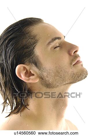 Close-up of a young man with his eyes closed View Large Photo Image Stock Image - Close-up of a young man with his eyes closed. Fotosearch