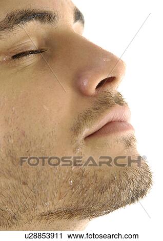 Close-up of a young man with his eyes closed View Large Photo Image Stock Image - Close-up of a young man with his eyes closed. Fotosearch