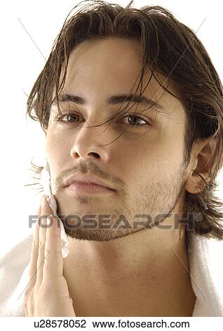 Portrait of a young man applying shaving cream View Large Photo Image Stock Image - Portrait of a young man applying shaving cream. Fotosearch