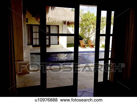 Swimming pool seen through a window View Large Photo Image Stock Photo - Swimming pool seen through a window. Fotosearch