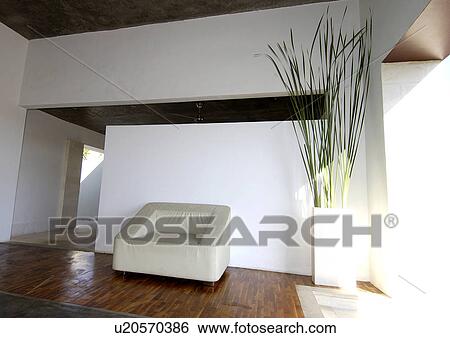 View of a comfortable sofa beside a dry arrangement, Bvilla+Spa. View Large Photo Image Stock Photograph - View of a comfortable sofa beside a dry arrangement, Bvilla+Spa.. Fotosearch