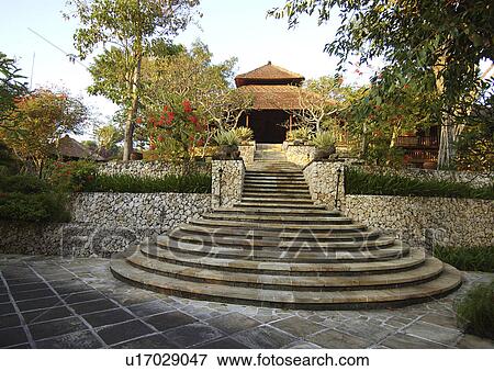 View of a staircase leading to the entrance of a shade in a resort. View Large Photo Image Stock Photo - View of a staircase leading to the entrance of a shade in a resort.. Fotosearch