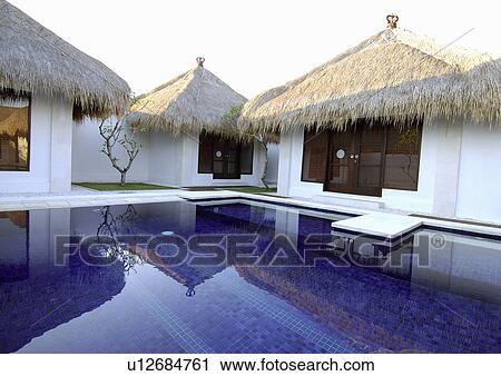 View of a swimming pool in a resort, Bvilla+Spa. View Large Photo Image Stock Image - View of a swimming pool in a resort, Bvilla+Spa.. Fotosearch