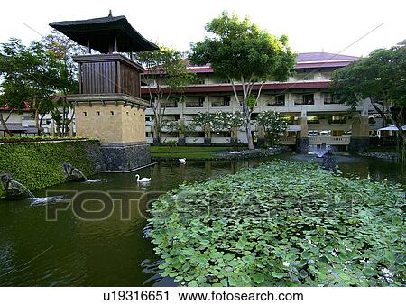 View of a pond outside a resort building View Large Photo Image Stock Image - View of a pond outside a resort building. Fotosearch