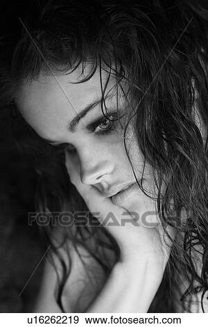 Young adult Caucasian woman with head resting on hand. View Large Photo Image Stock Photo - Young adult Caucasian woman with head resting on hand.. Fotosearch
