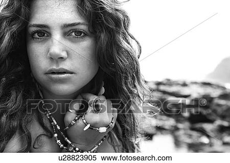 Stock Photography - Young adult female looking at viewer. Fotosearch