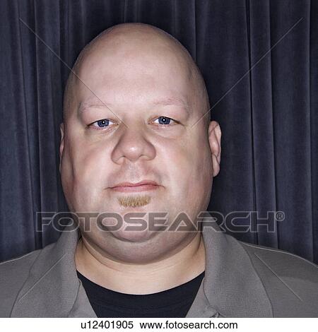 Stock Photography - Bald man looking at viewer. Fotosearch