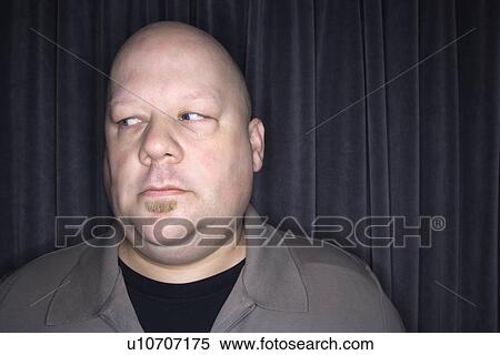 Stock Photography - Bald man looking to side.. Fotosearch