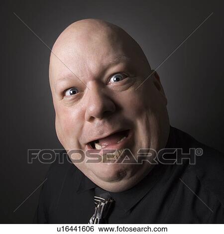Bald man making a crazy face View Large Photo Image Stock Photograph - Bald man making a crazy face. Fotosearch