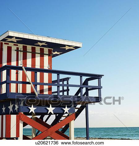 Stock Photograph - Lifeguard tower painted red, white and blue with stars and stripes on beach in Miami, Florida, USA.. Fotosearch