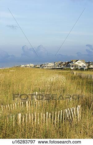 Natural beach area with houses. View Large Photo Image Stock Photo - Natural beach area with houses.. Fotosearch