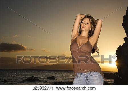 Woman with arms behind head View Large Photo Image Stock Image - Woman with arms behind head. Fotosearch