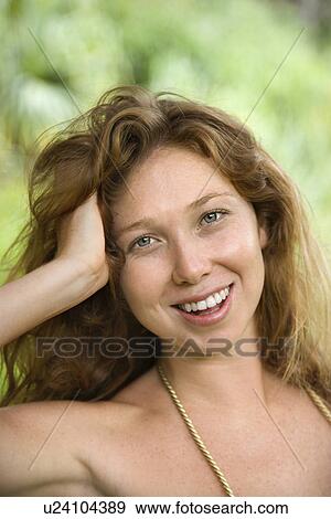Woman in lush forest smiling View Large Photo Image Stock Photo - Woman in lush forest smiling. Fotosearch
