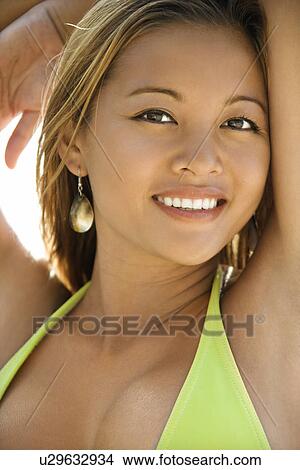 Picture - Female in swimsuit smiling. Fotosearch