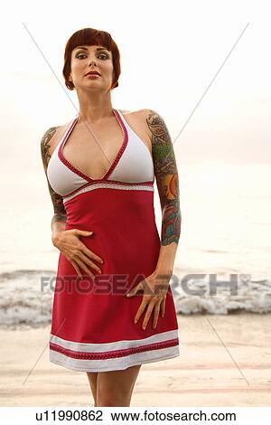 Tattooed woman on beach View Large Photo Image Stock Image - Tattooed woman on beach . Fotosearch