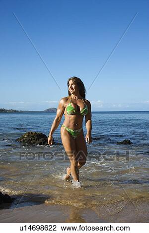 Woman bodybuilder in bikini walking View Large Photo Image Stock Image - Woman bodybuilder in bikini walking . Fotosearch