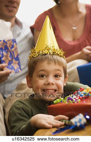 Stock Photography - Boy at birthday party. Fotosearch