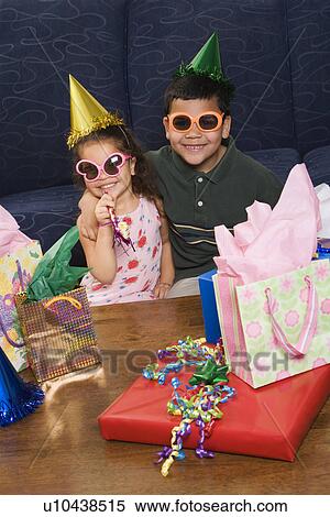 Stock Photography - Brother and sister wearing sunglasses . Fotosearch