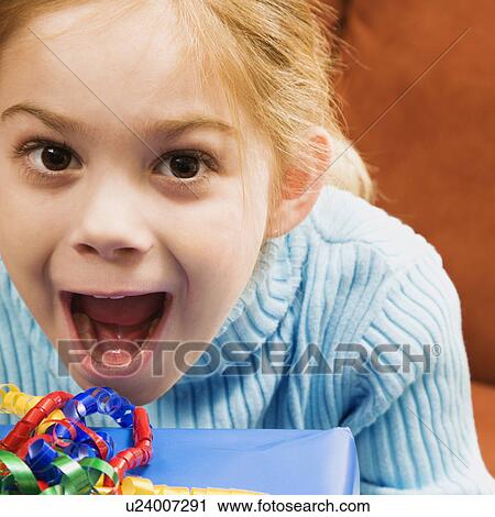 Girl with excited expression looking at viewer View Large Photo Image Stock Image - Girl with excited expression looking at viewer. Fotosearch