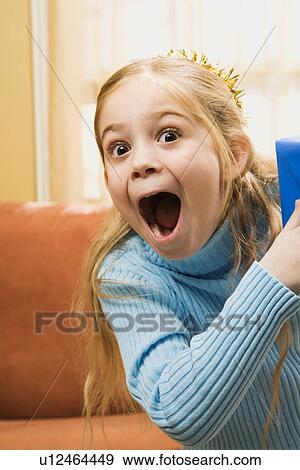 Stock Photo - Girl with excited expression. Fotosearch