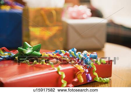 Presents wrapped on a table View Large Photo Image Stock Image - Presents wrapped on a table. Fotosearch